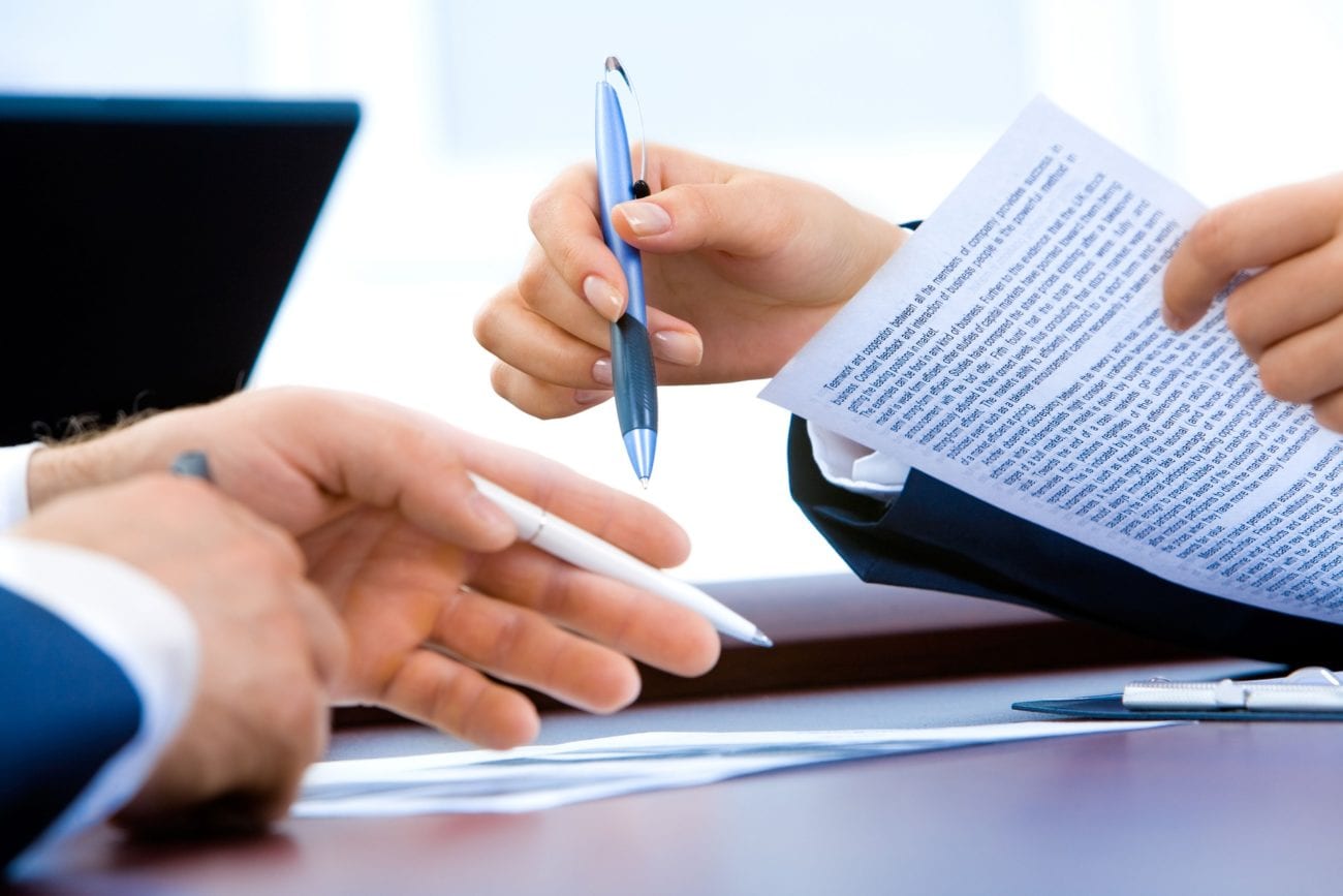 Businesspeople signing document